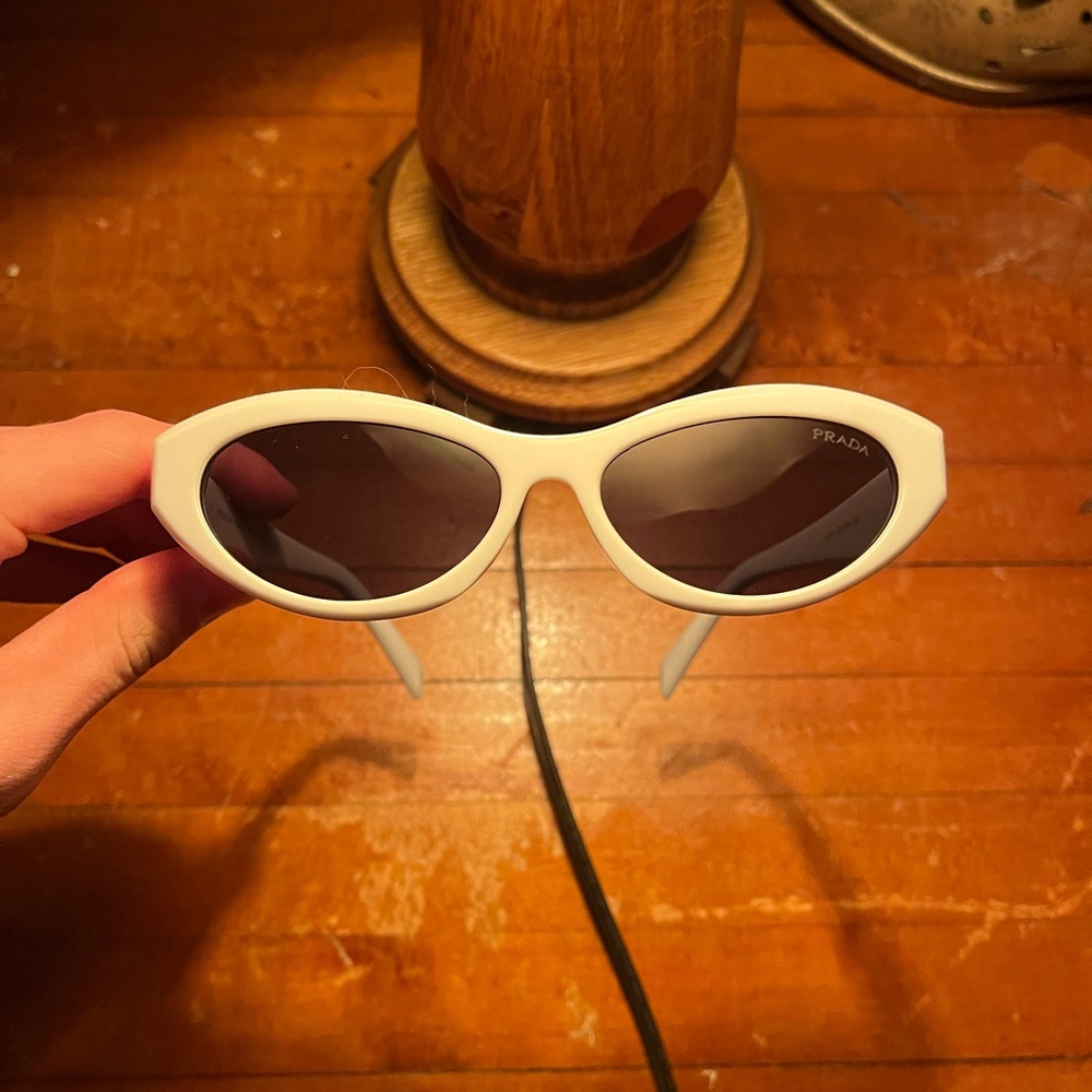 White prada sunglasses bone white frame charcoal lens with prada details